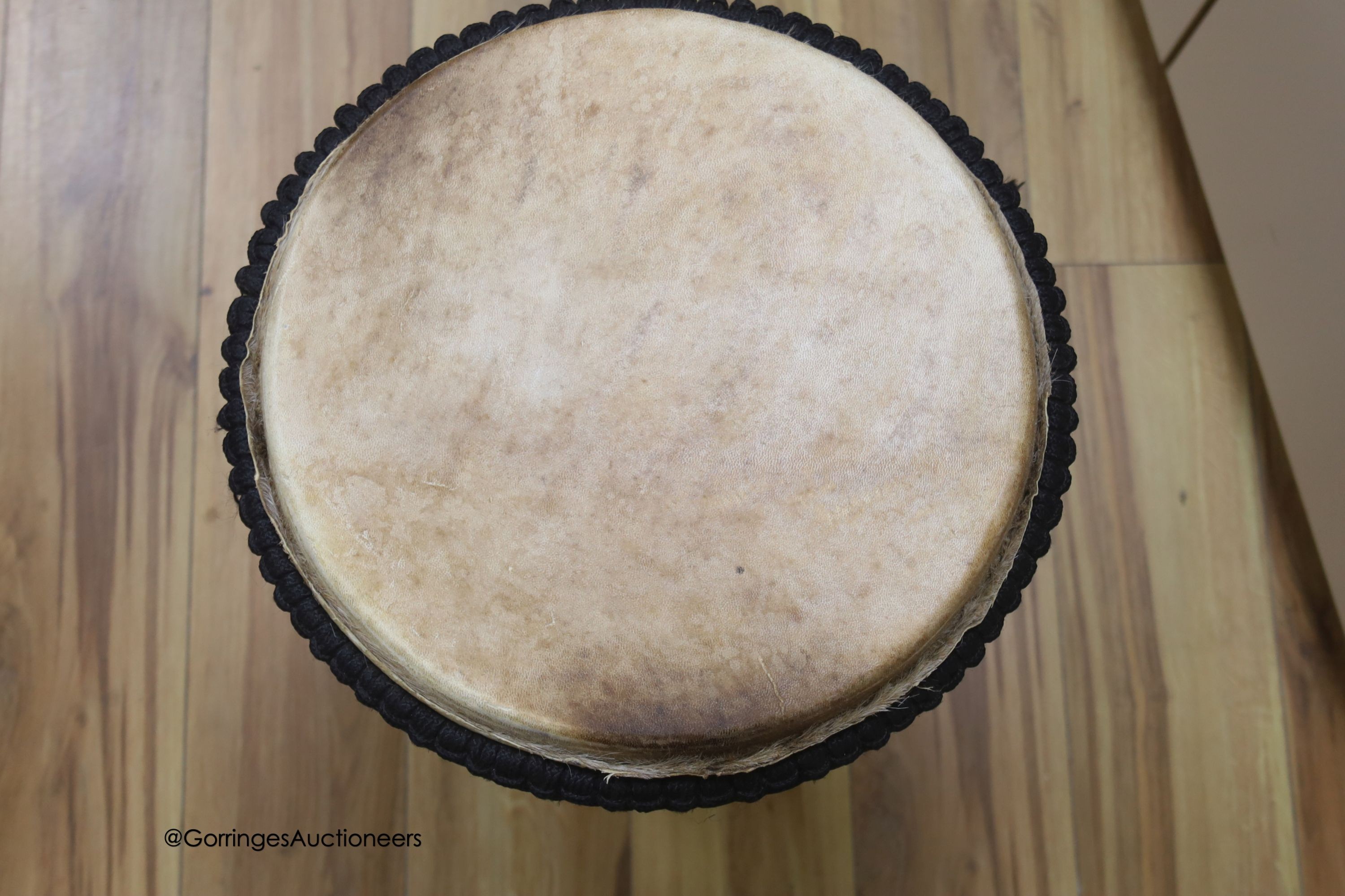 A Ghanian Djembe drum, height 62cm